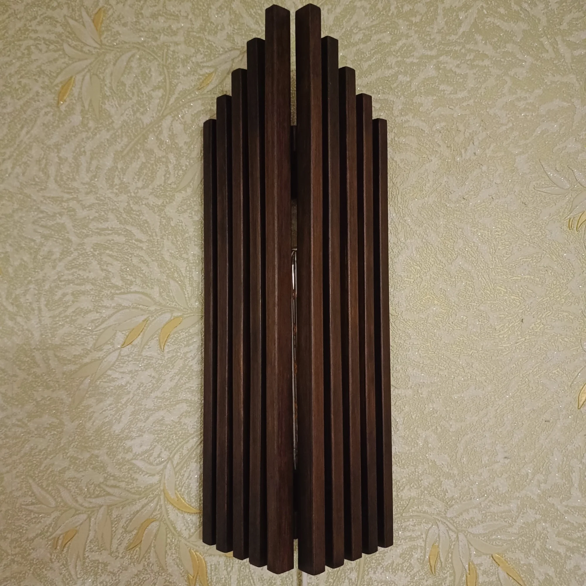 Handmade alder wood wall sconce front view