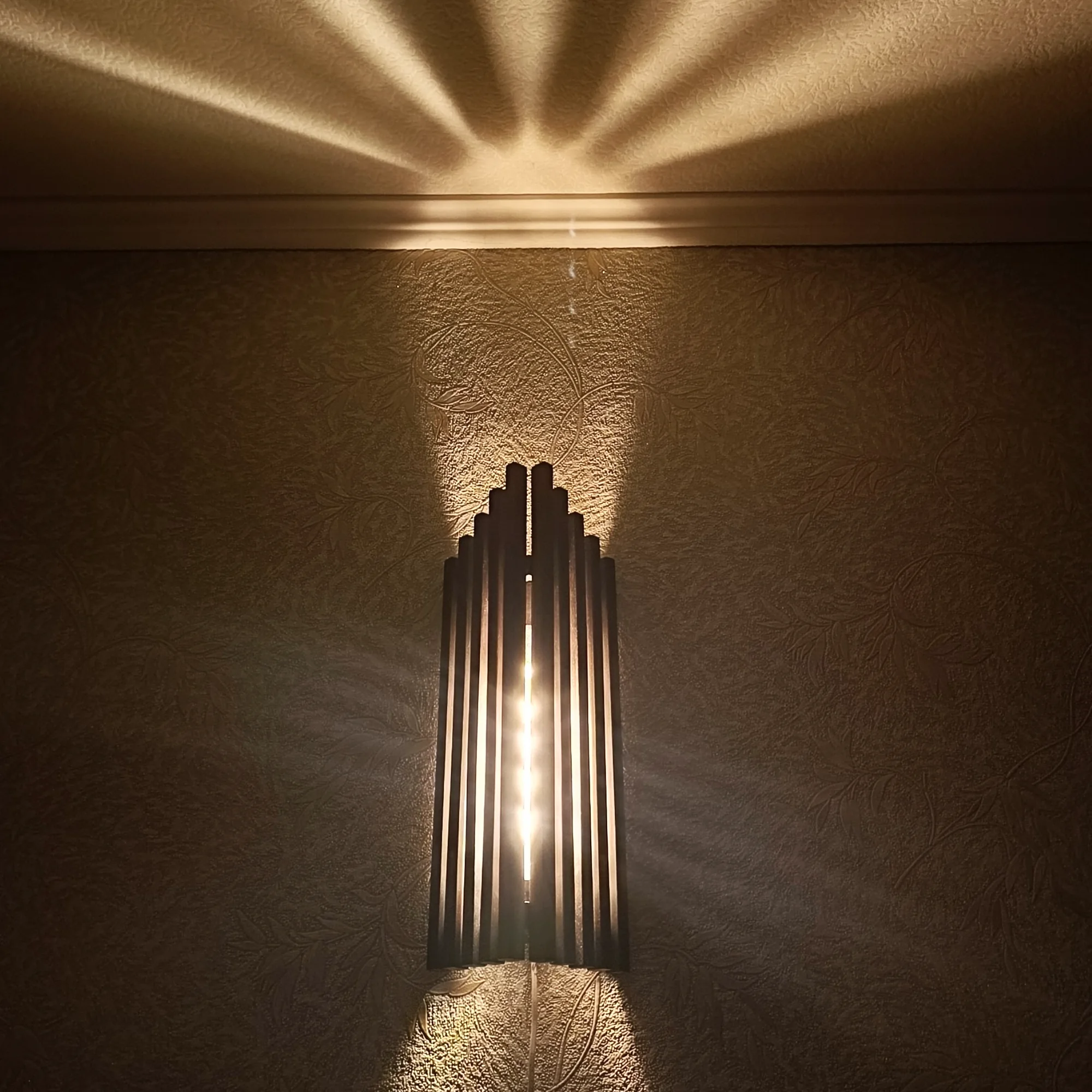 Handmade alder wood wall sconce with warm glow